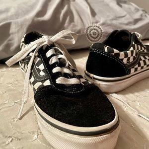 Black and white checkered Vans. Big kid 4.